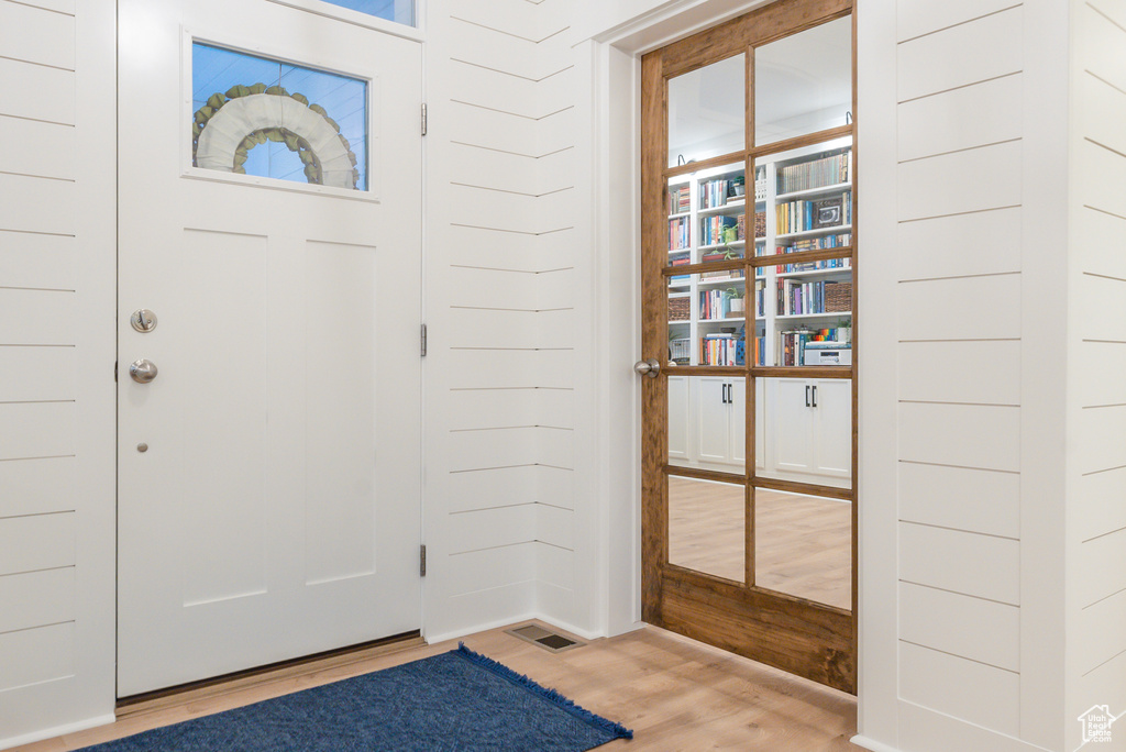 Entrance foyer featuring wood finished floors