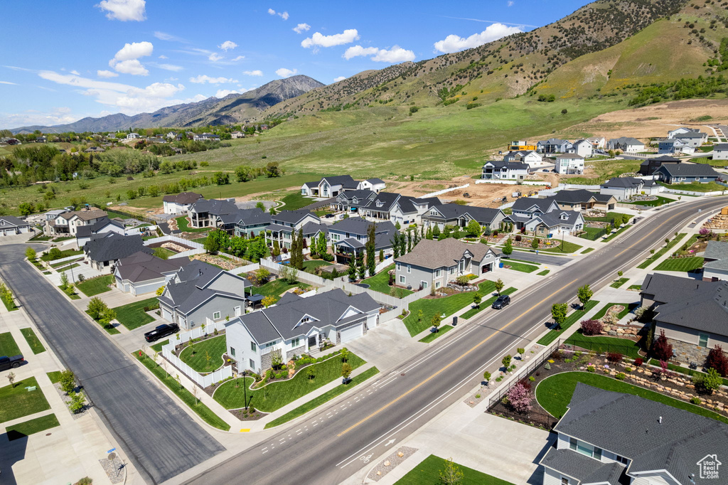 View of property location with mountains and nearby suburban area