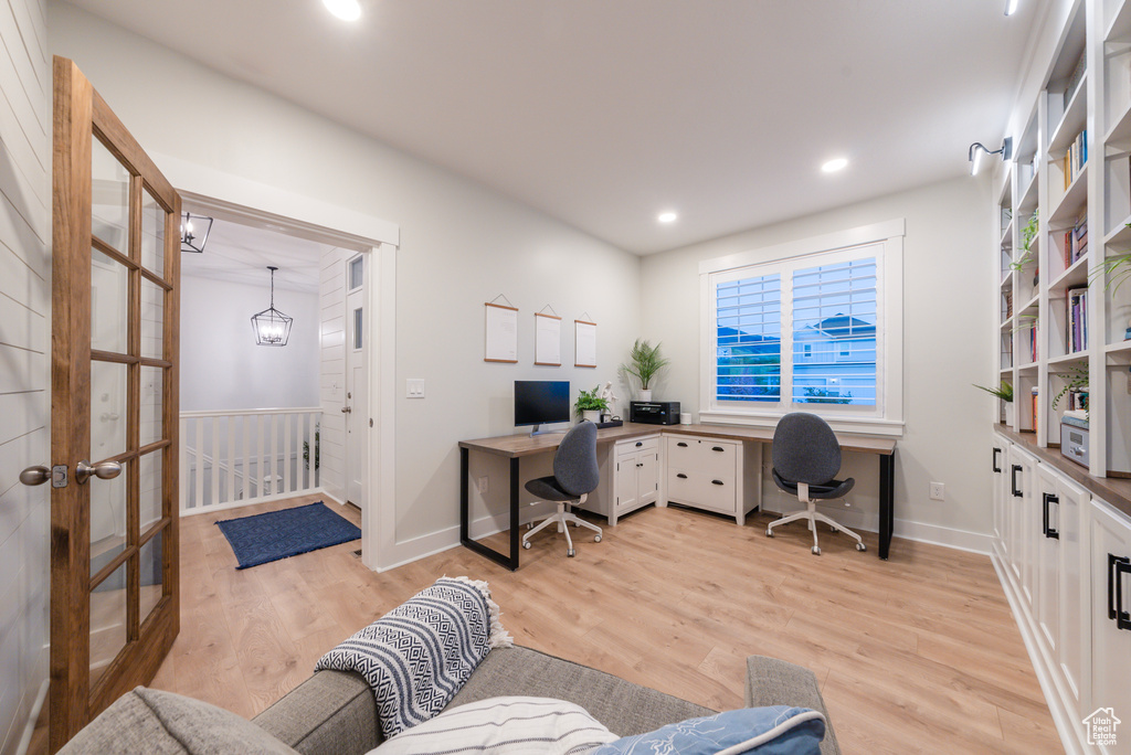 Office featuring light wood-type flooring, baseboards, and recessed lighting