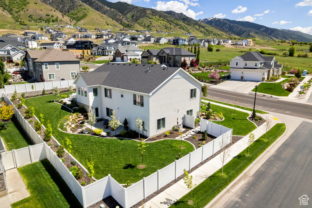 Aerial view of residential area with a mountainous background