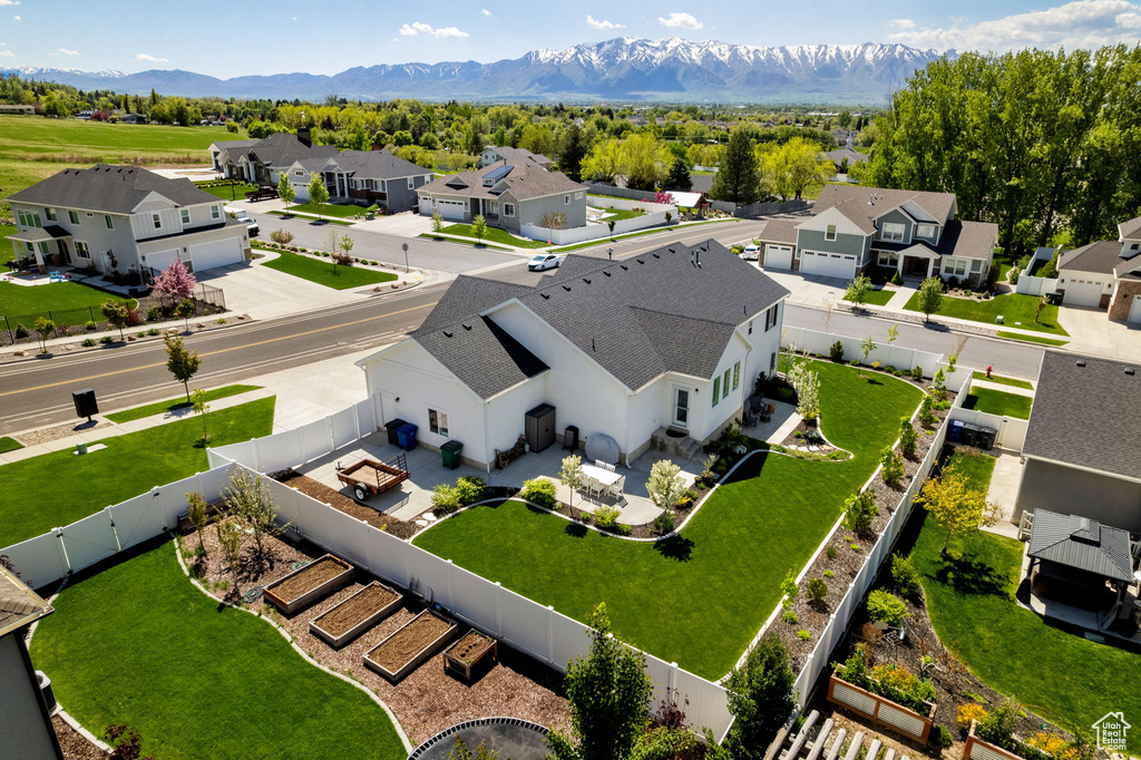 Aerial view of residential area featuring a mountain backdrop