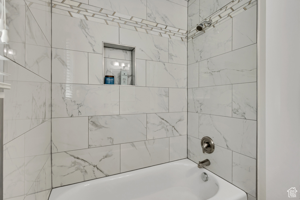 Full bathroom with bathtub / shower combination