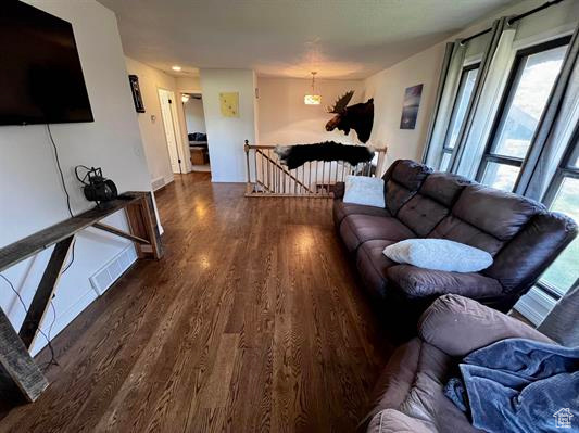Living area featuring wood finished floors and baseboards