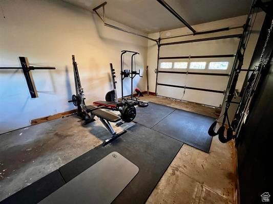 Exercise room featuring a garage