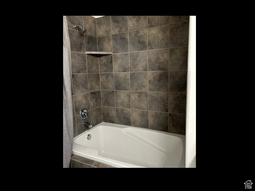 Bathroom featuring tub / shower combination
