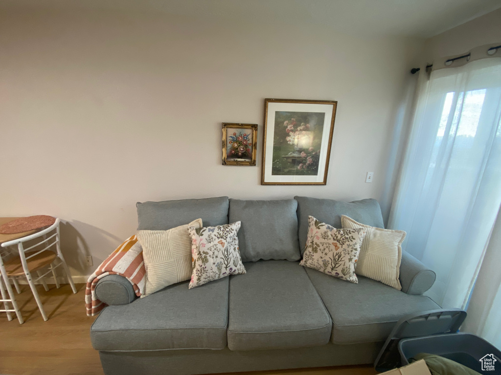 Living room with wood finished floors and baseboards