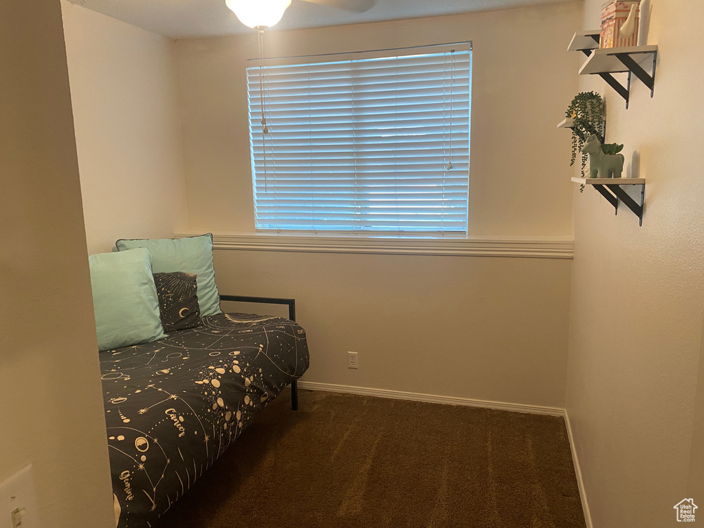Carpeted bedroom with baseboards