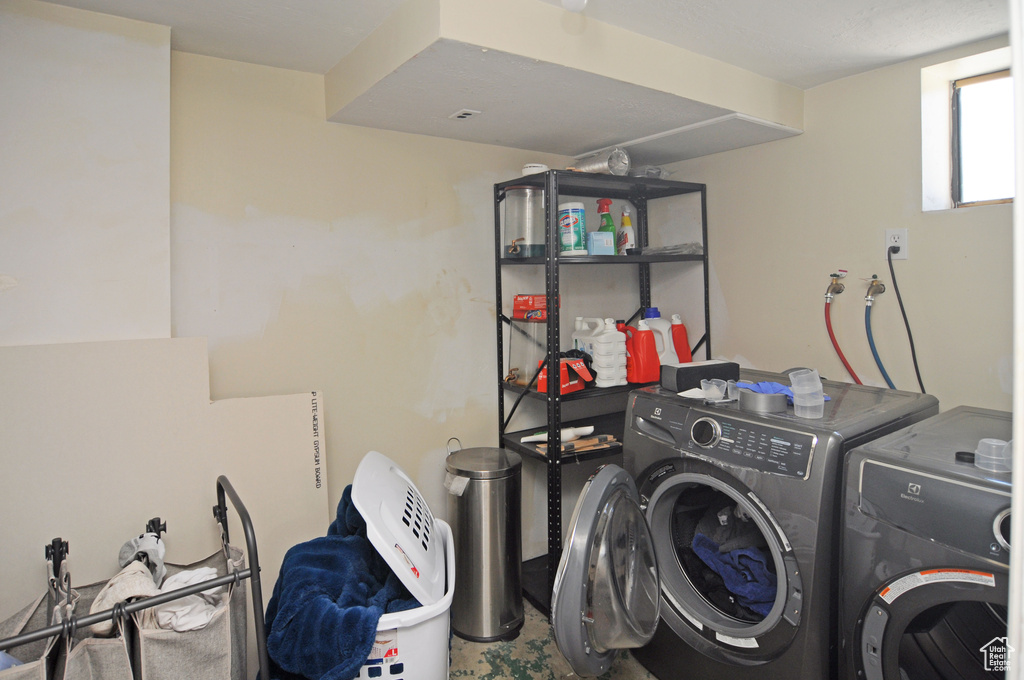 Laundry room featuring independent washer and dryer