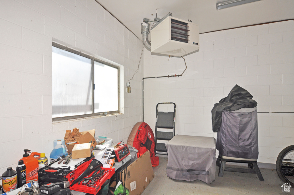 Garage with a heating unit and concrete block wall