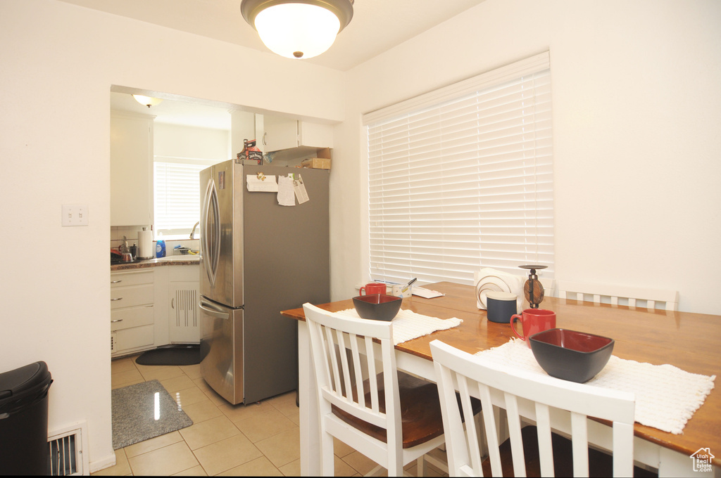 Dining room featuring light tile patterned floors