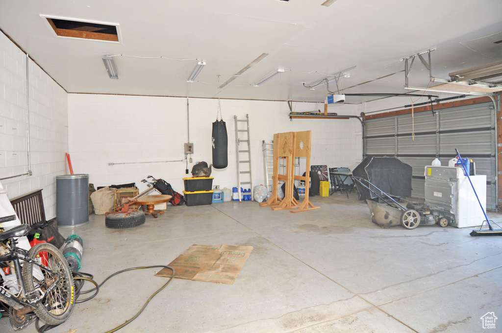 Garage featuring a garage door opener