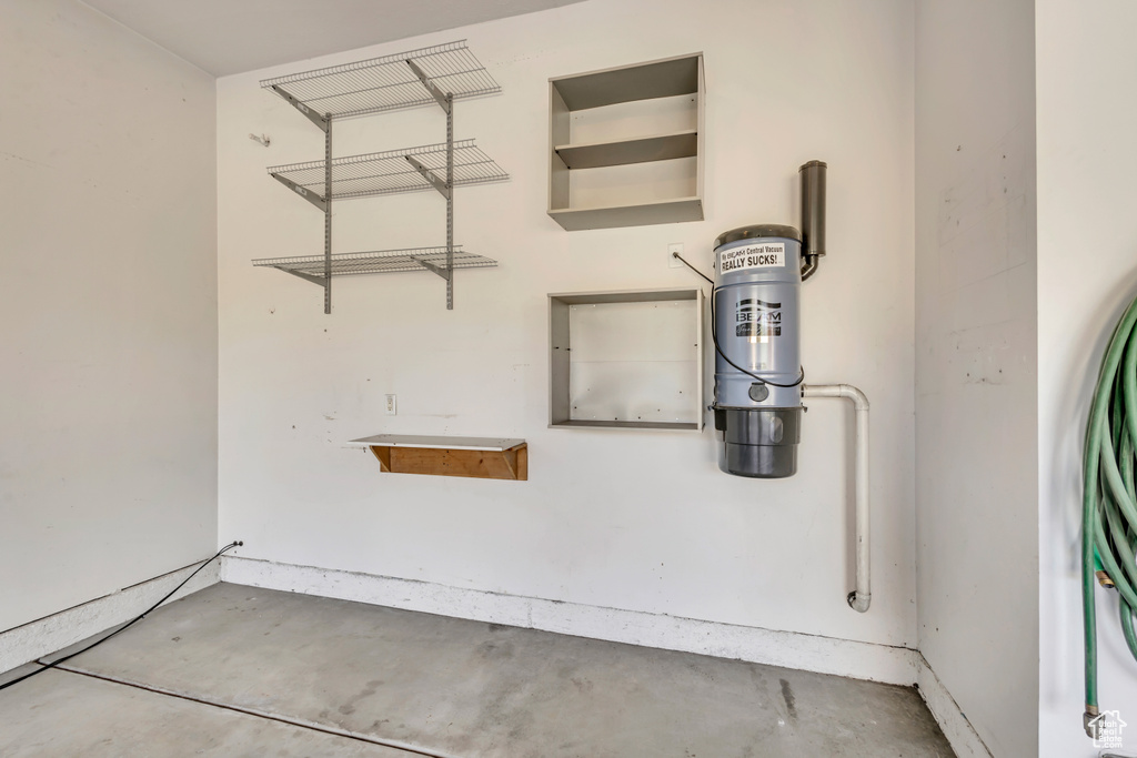 Detailed view of concrete flooring and a central vacuum unit