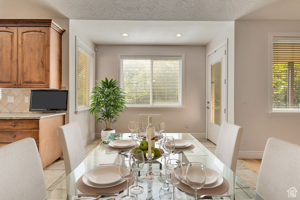 Dining area featuring healthy amount of natural light, recessed lighting, and baseboards