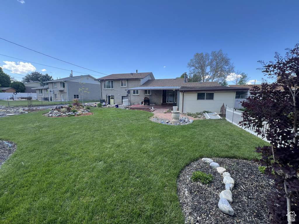 Rear view of property with a patio