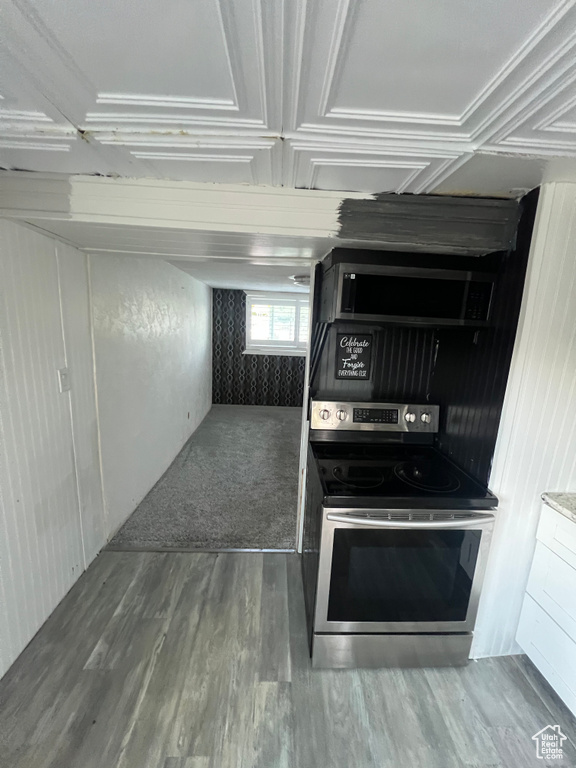 Kitchen with stainless steel appliances and wood finished floors