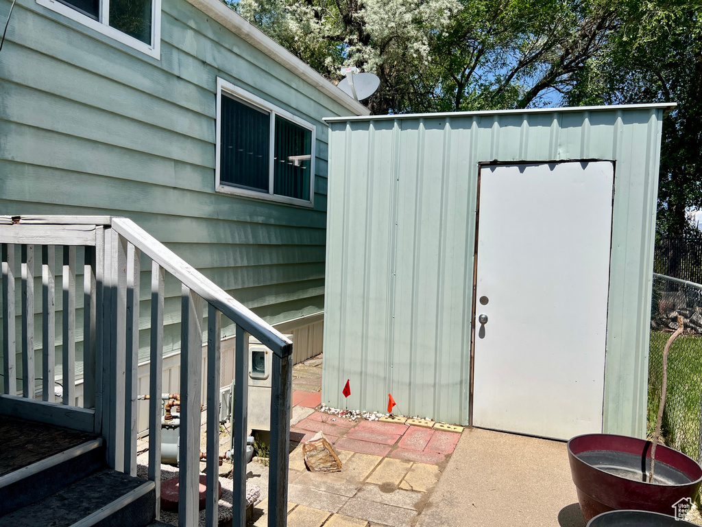 Property entrance featuring board and batten siding