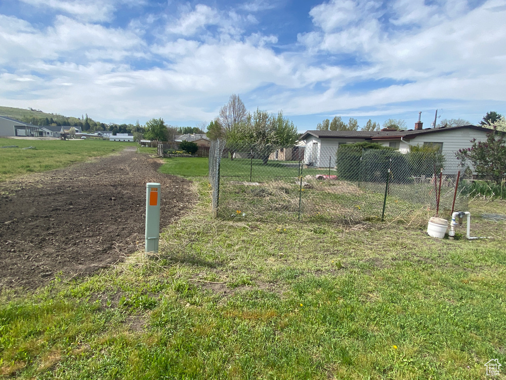 View of yard featuring fence
