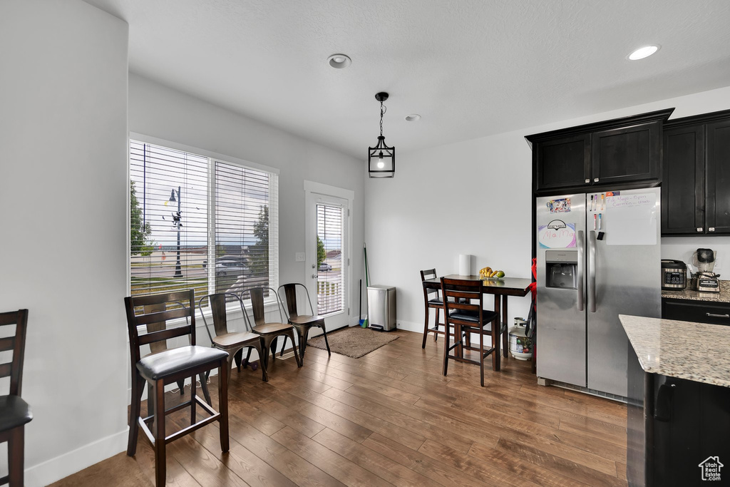 Dining space featuring recessed lighting, baseboards, and wood finished floors