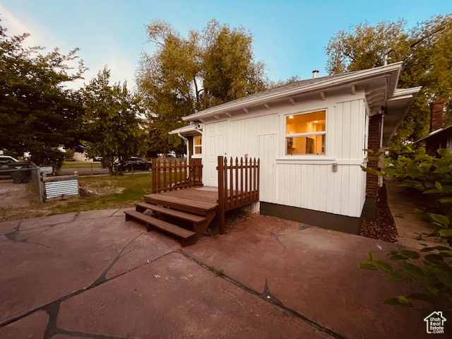 Back of property with a patio area and a deck