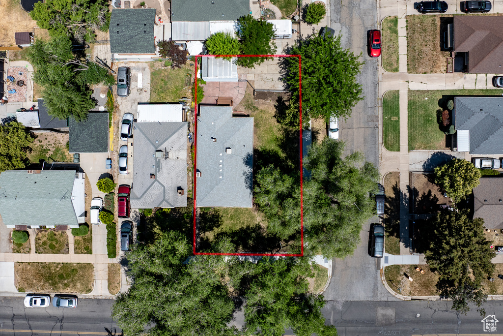 Aerial perspective of suburban area featuring property boundaries highlighted