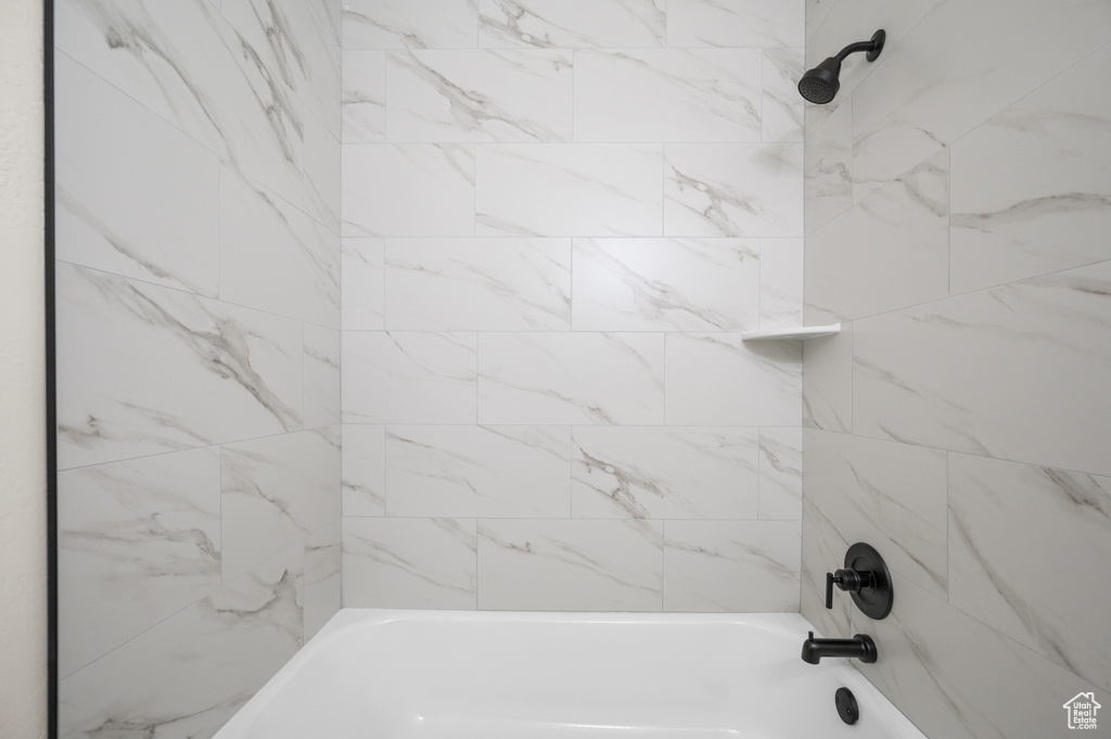 Full bathroom with shower / bathtub combination