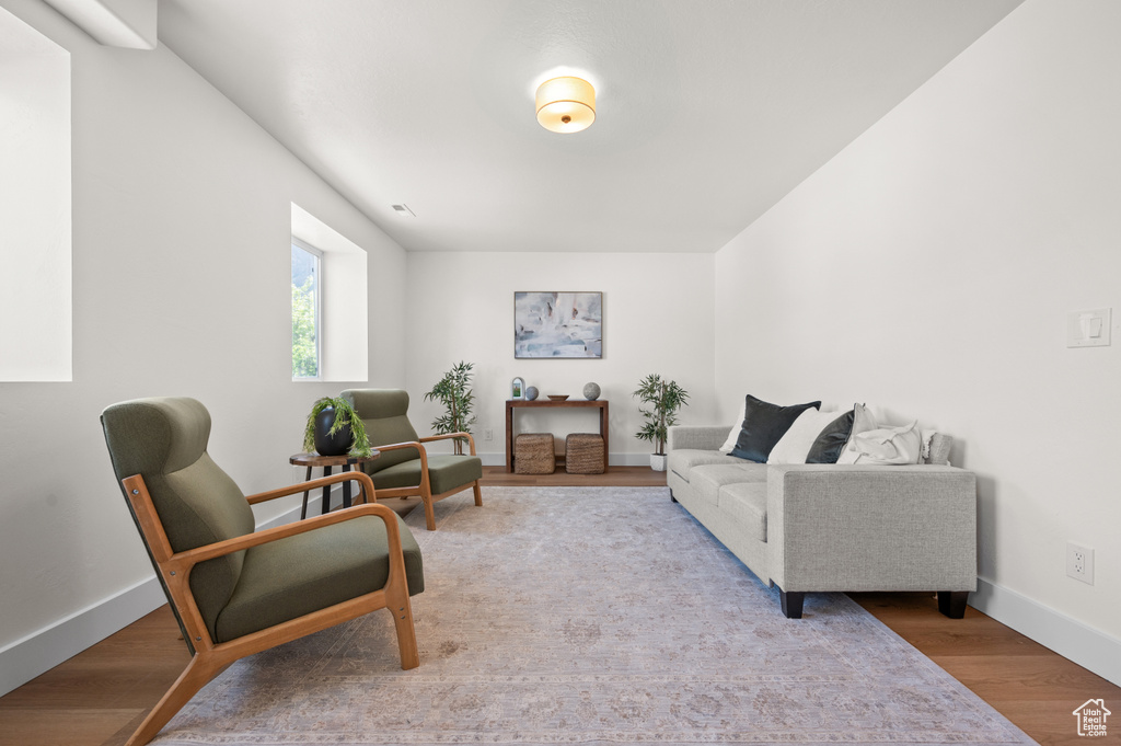 Living room featuring baseboards and wood finished floors