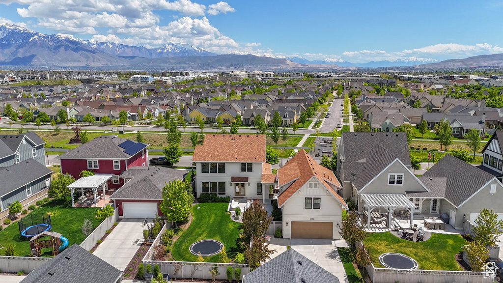 Aerial view of residential area featuring a mountain backdrop