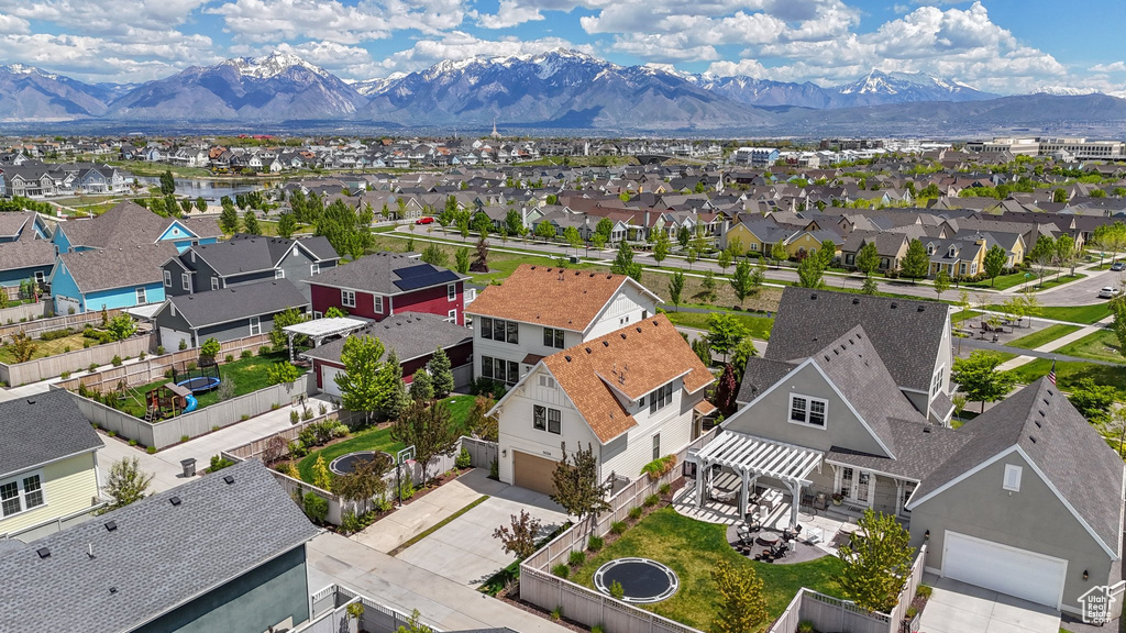Aerial view of residential area featuring a mountain backdrop