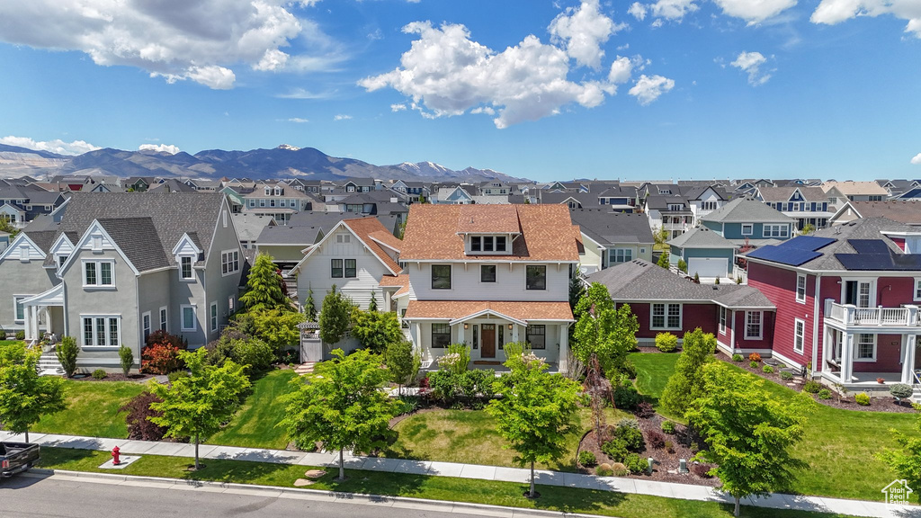 Aerial view of residential area with a mountainous background
