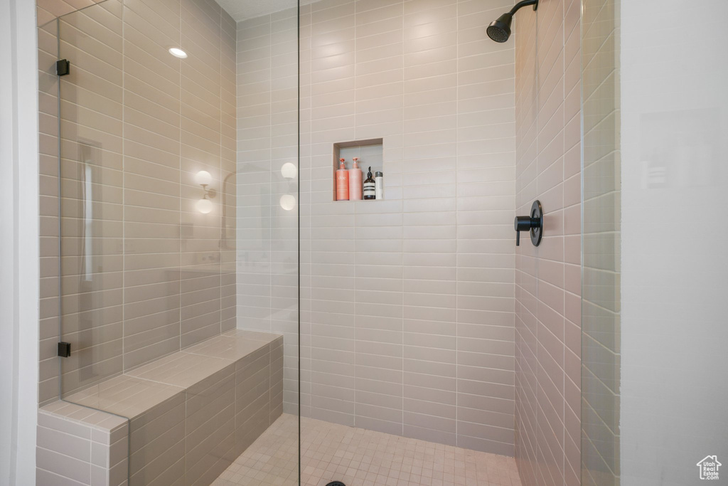 Full bathroom with tiled shower