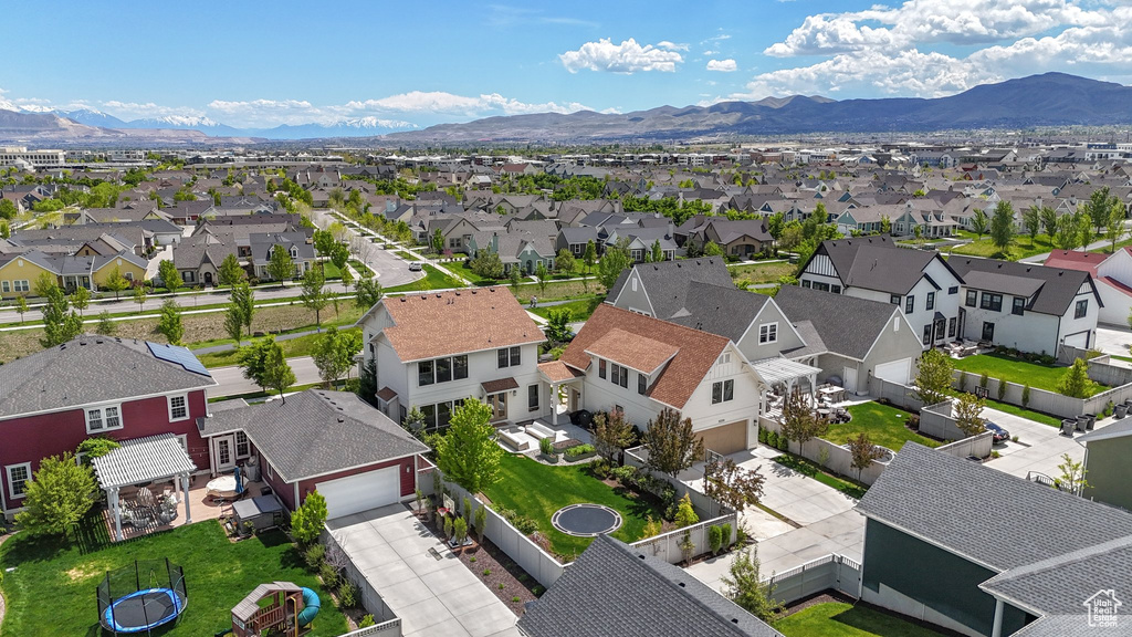 Aerial perspective of suburban area with a mountainous background