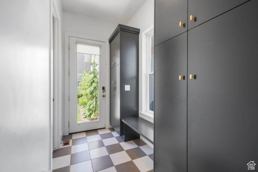 Mudroom featuring light flooring