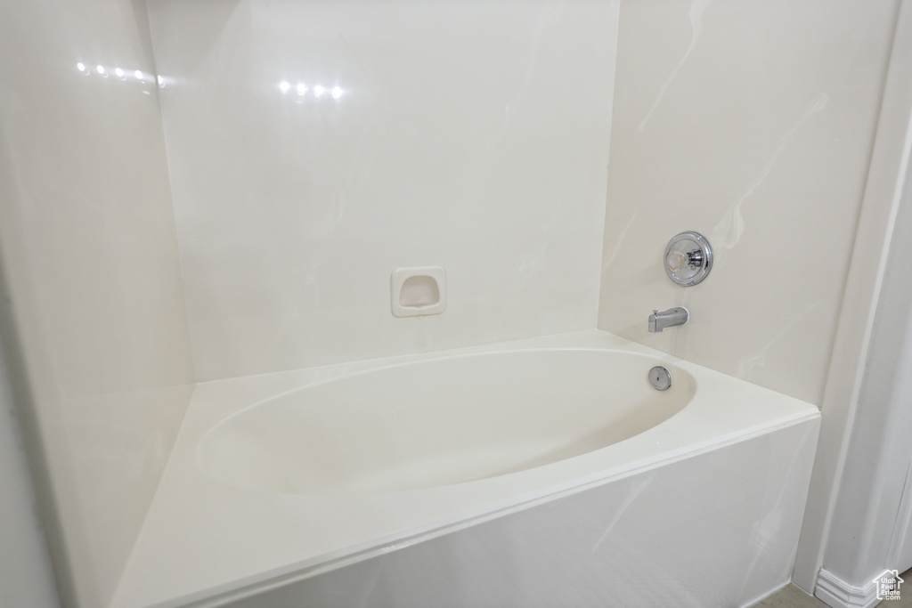 Full bathroom with a tub to relax in and a shower