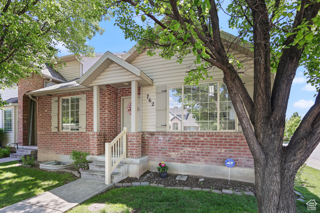 View of front of home with brick siding