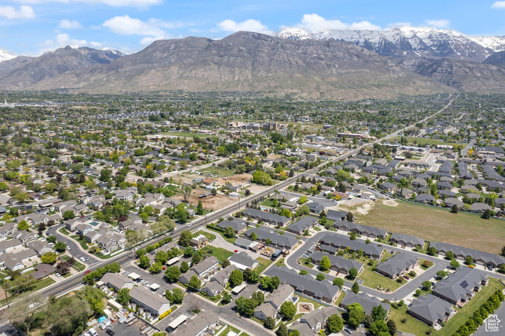 View of property location featuring a mountainous background and nearby suburban area