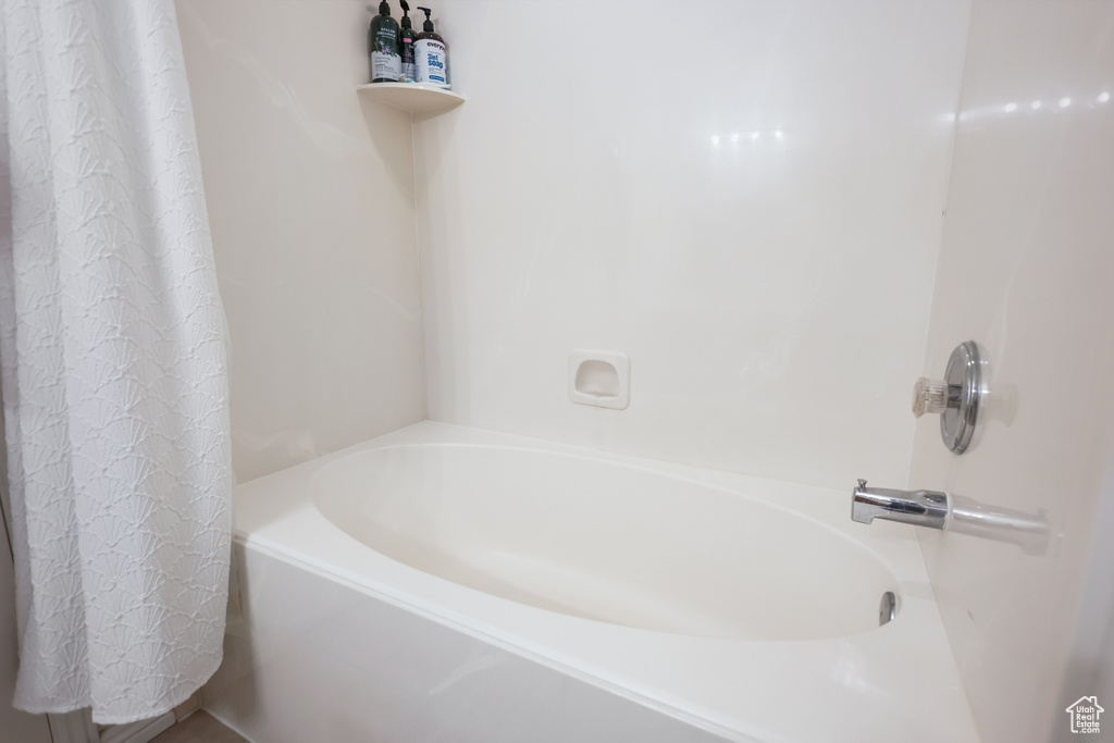 Bathroom with shower / tub combo with curtain