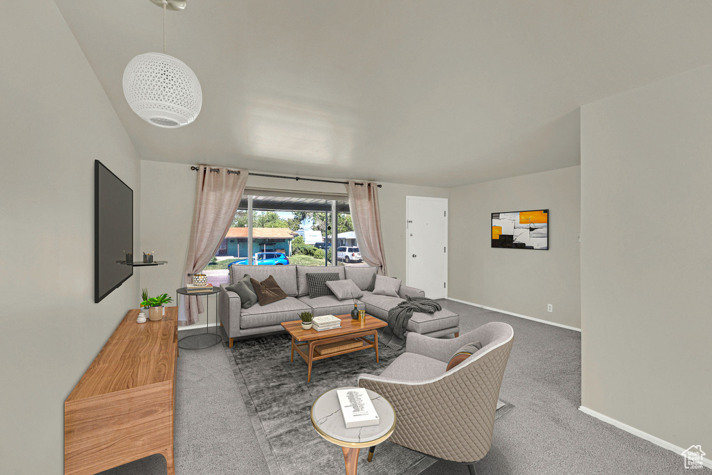 Living room featuring baseboards and carpet floors