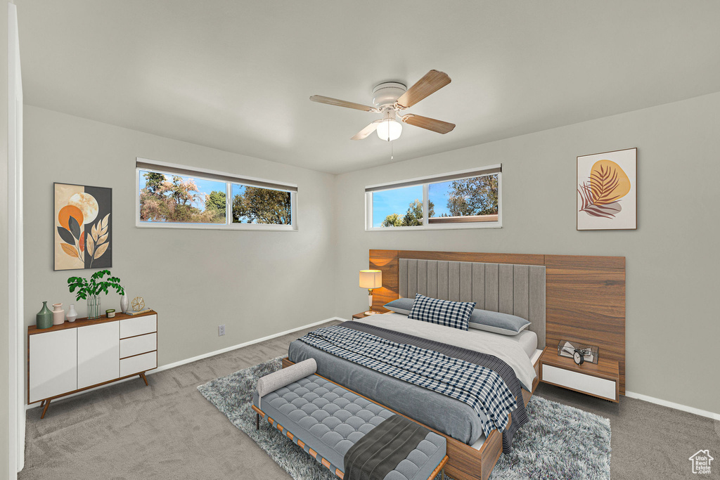 Bedroom featuring carpet, baseboards, and ceiling fan