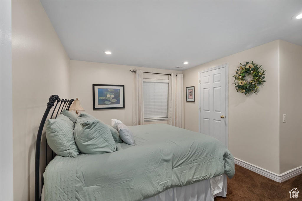 Bedroom featuring carpet flooring, baseboards, and recessed lighting