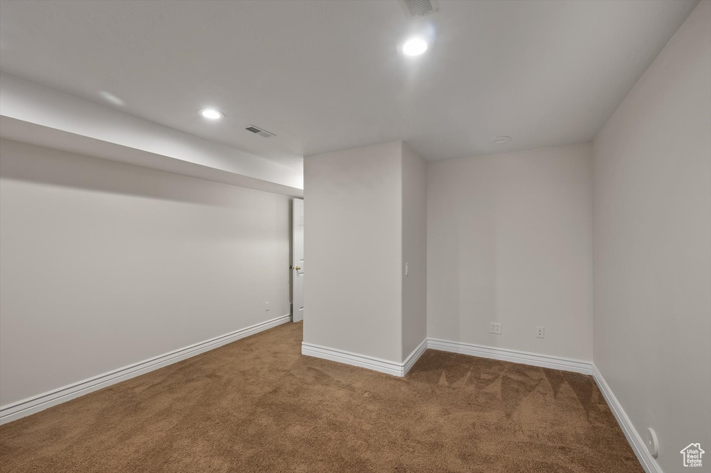 Below grade area featuring carpet flooring, baseboards, and recessed lighting