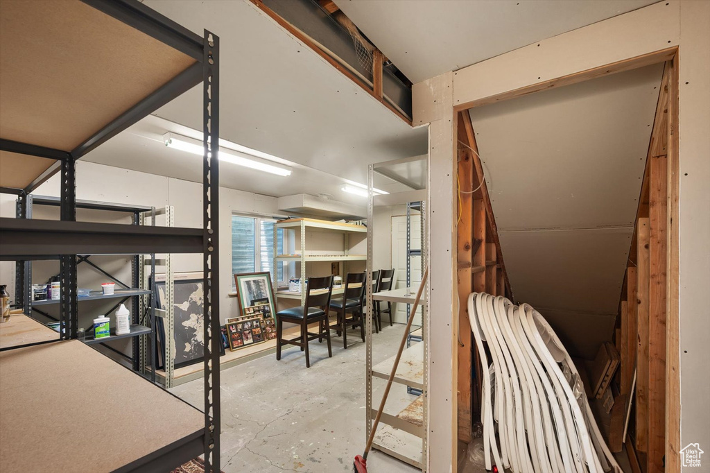Miscellaneous room with unfinished concrete flooring
