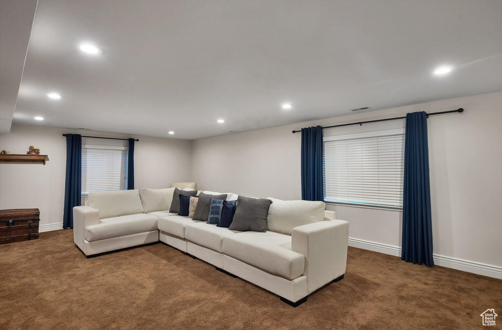 Living area featuring carpet flooring, recessed lighting, and baseboards