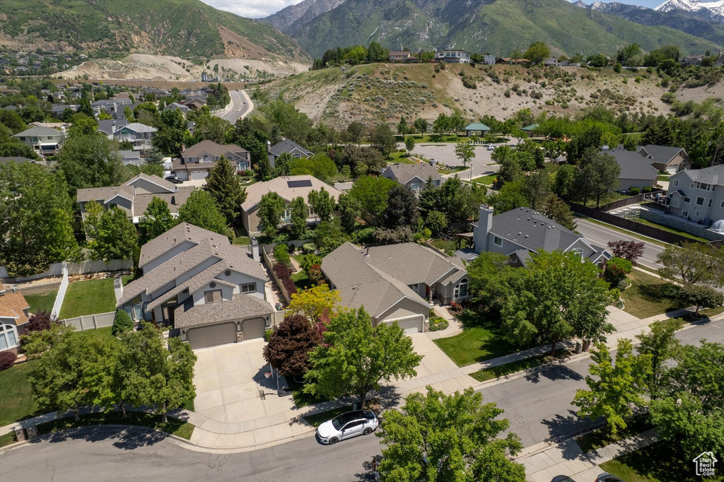 Aerial perspective of suburban area featuring a mountain backdrop