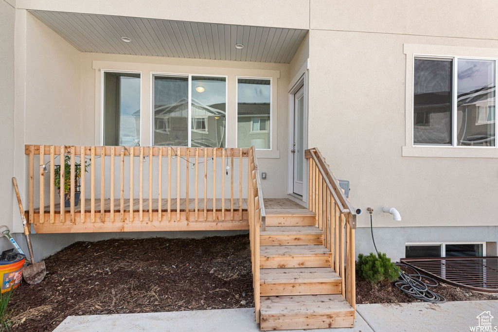 Property entrance with stucco siding