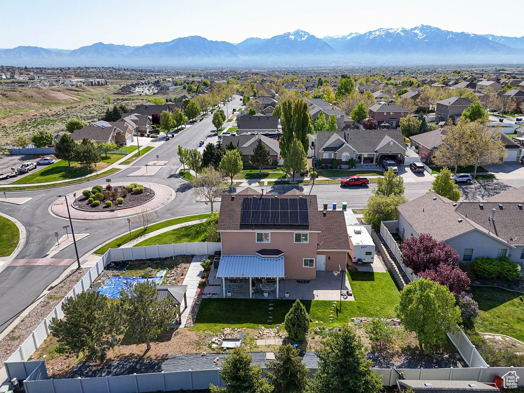 Aerial perspective of suburban area with a mountainous background