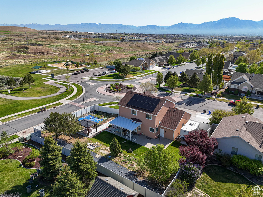 Aerial view of residential area featuring a mountainous background