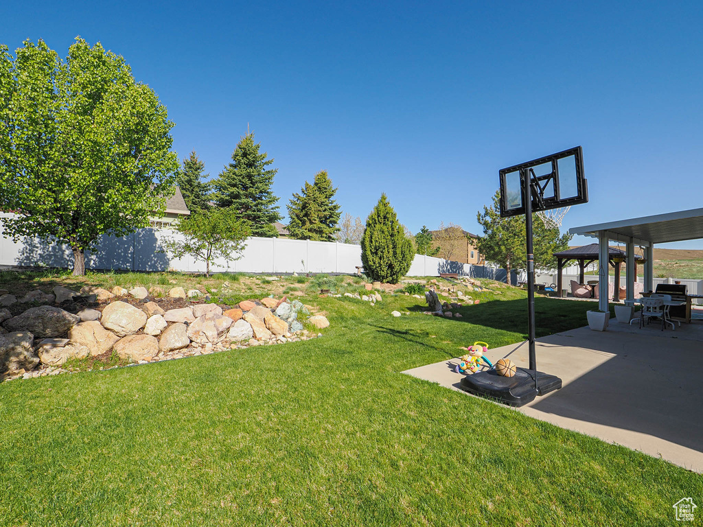 View of yard with a gazebo and a patio area