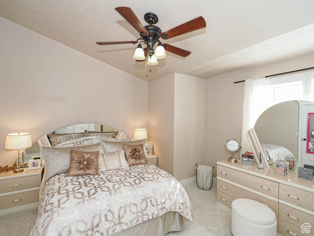 Bedroom with baseboards and ceiling fan