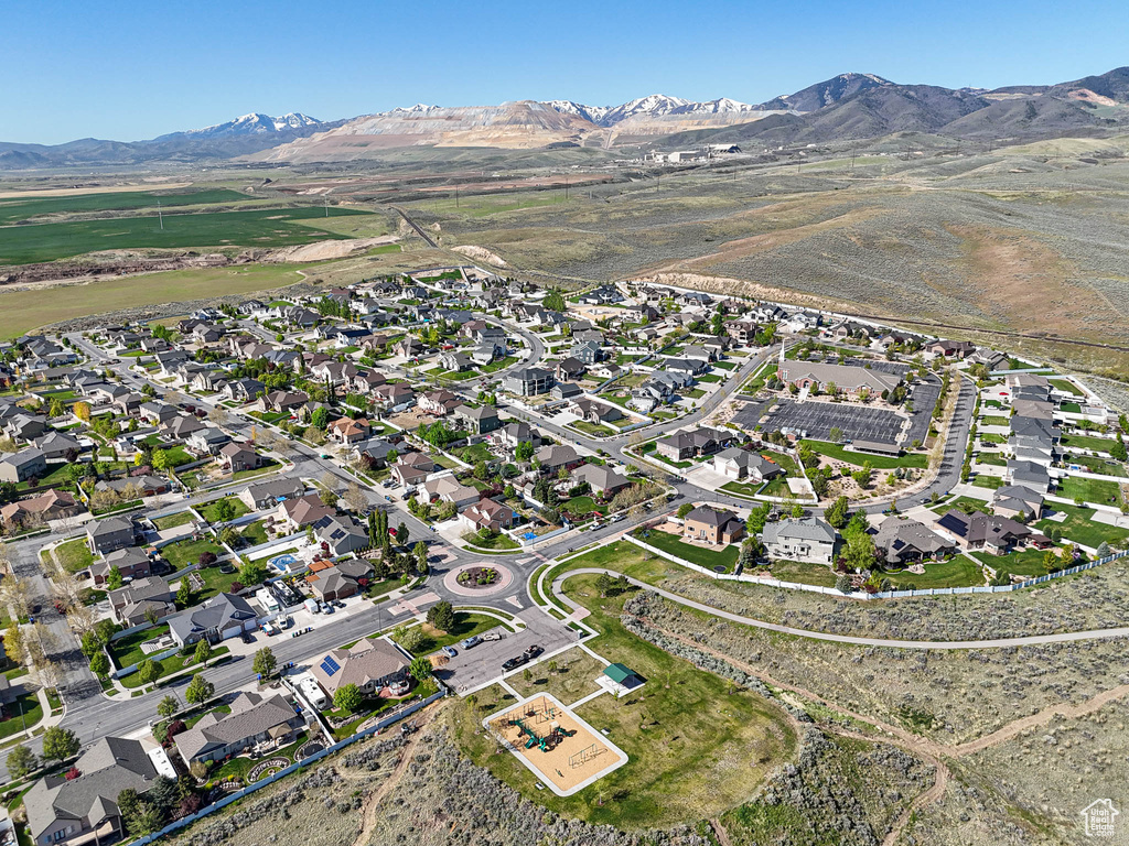View of property location with a mountain backdrop and nearby suburban area