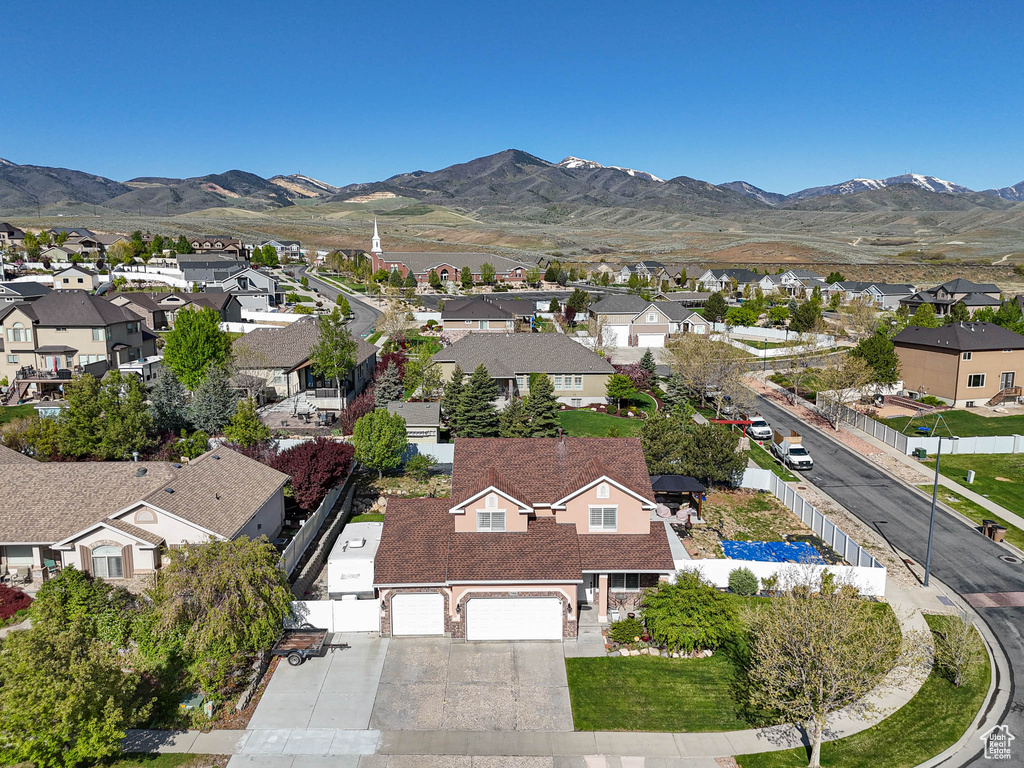 Aerial view of residential area featuring mountains